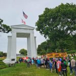 people gather near monument