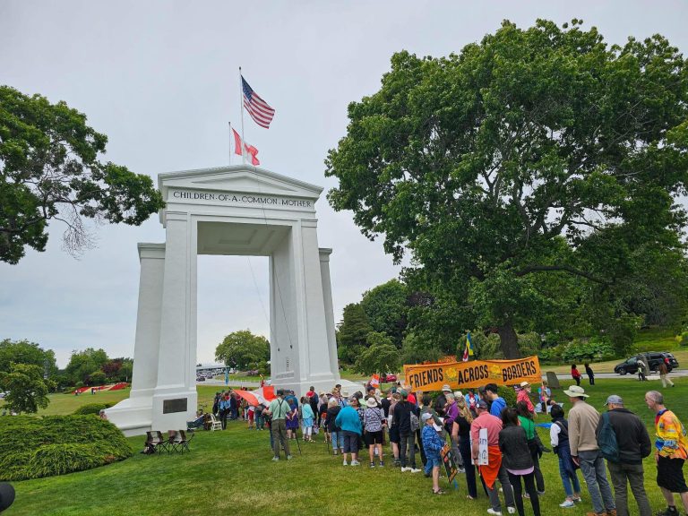 people gather near monument