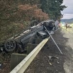 Overturned stolen vehicle on I-5 southbound near Exit 21 in Vancouver with lanes blocked and emergency crews on scene