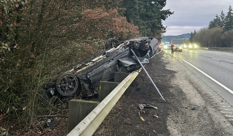 Overturned stolen vehicle on I-5 southbound near Exit 21 in Vancouver with lanes blocked and emergency crews on scene