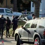 Police detain man during hazmat response at Lincoln Square Apartments in Bellingham