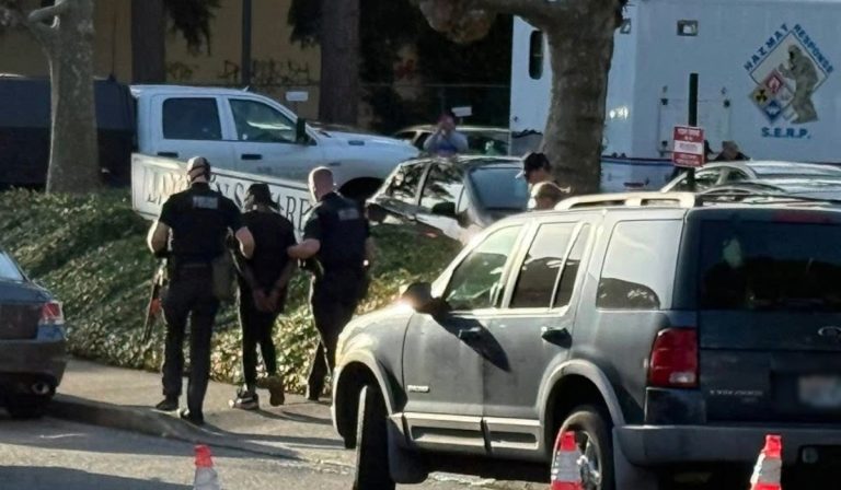 Police detain man during hazmat response at Lincoln Square Apartments in Bellingham