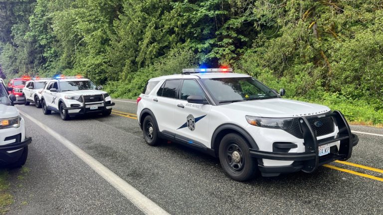 State Troopers respond to the deadly crash Saturday with cars on the highway