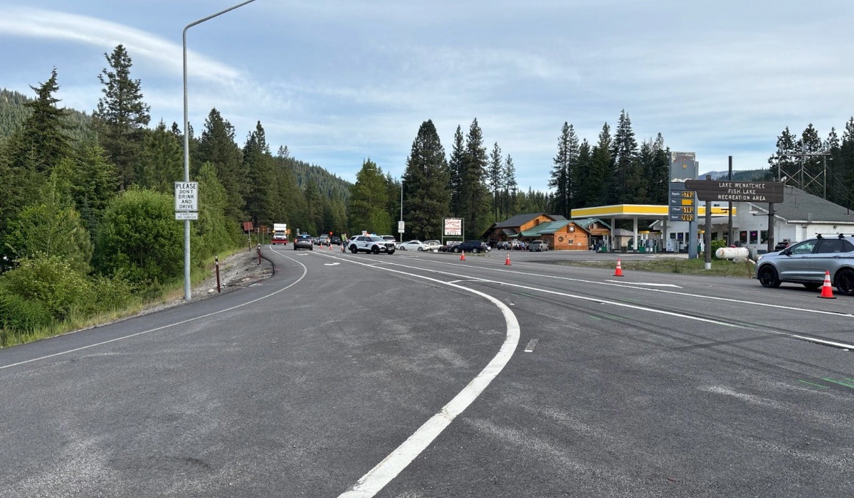 Emergency vehicles block State Route 2 near SR 207 following a fatal three-car crash on May 23, 2026