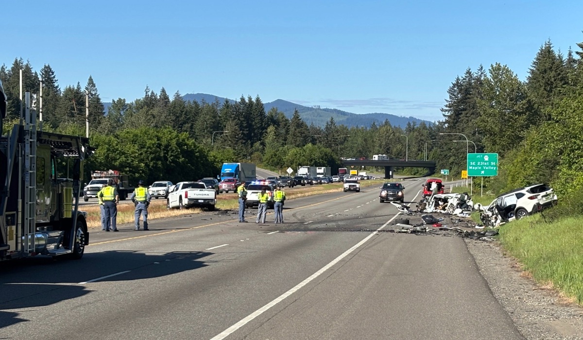 Emergency crews investigate a fatal four-vehicle collision on State Route 18 near Southeast 231st Street and the SR 169 interchange in Maple Valley on Thursday, May 21, 2026. One person died and three others were injured after a vehicle crossed the median into opposing traffic.