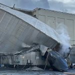 Collapsed chemical storage tank at the Nippon Dynawave Packaging mill in Longview following Tuesday’s deadly industrial disaster