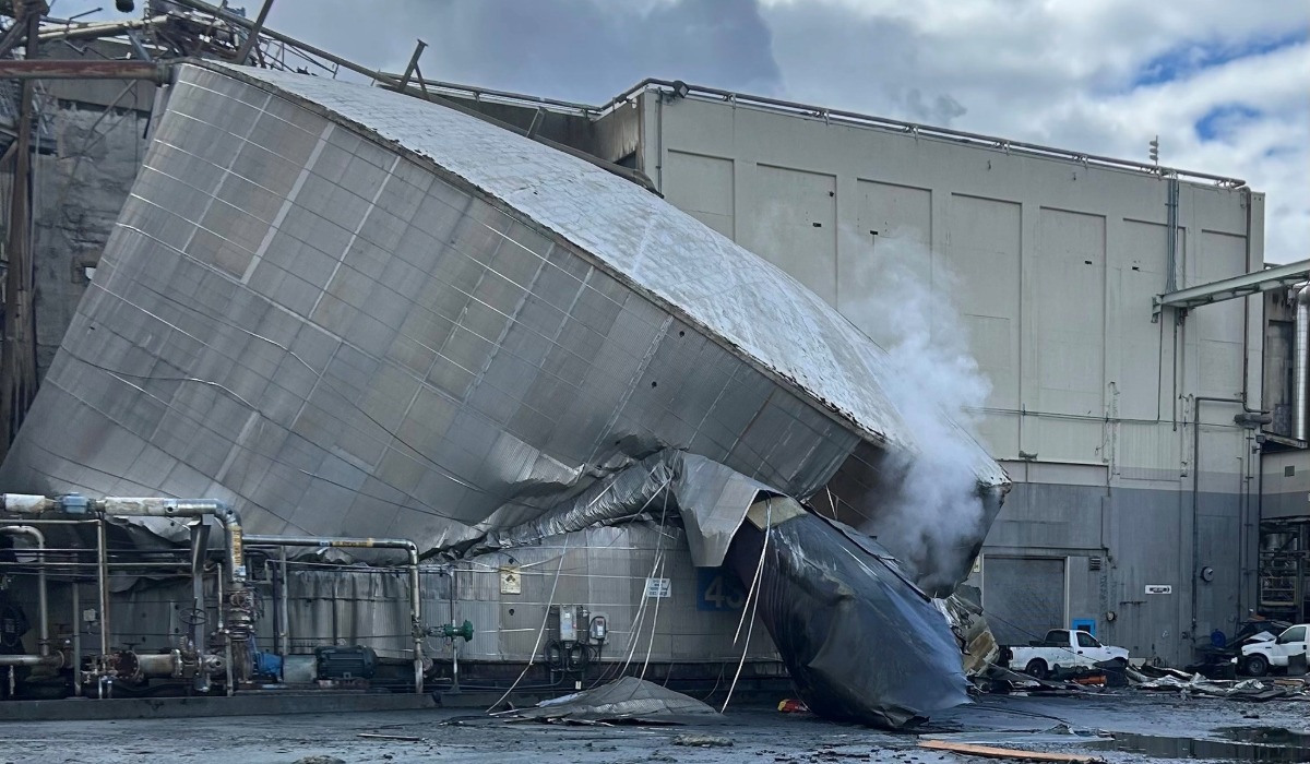 Collapsed chemical storage tank at the Nippon Dynawave Packaging mill in Longview following Tuesday’s deadly industrial disaster