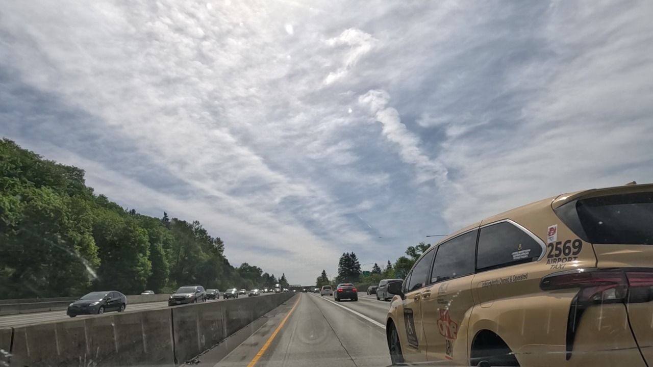 A taxi cut into the I-5 HOV lane near SeaTac with no passenger and nearly caused a crash.