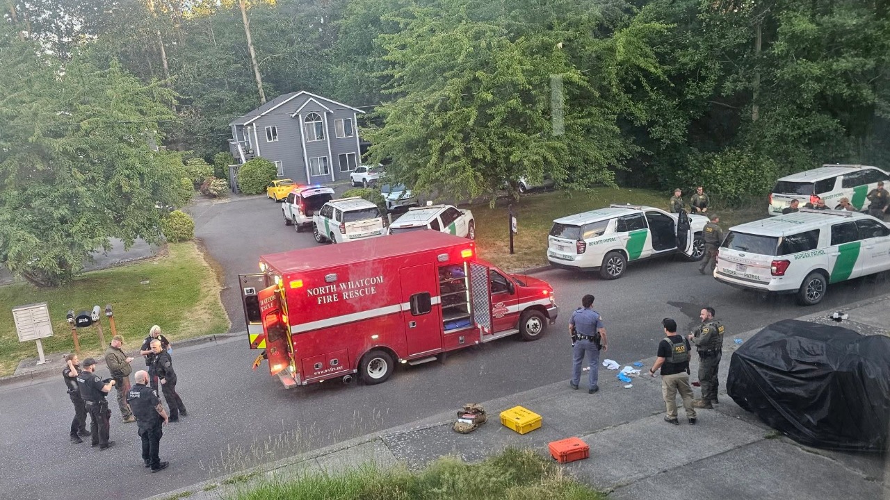 Emergency responders and federal agents gather at the scene of a U.S. Border Patrol-involved shooting in Blaine on Tuesday. The FBI is leading the investigation into the incident, which occurred in a residential neighborhood near Fourth Street and A Street. Photo courtesy of Sam Kimbell.