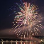Fireworks explode over Semiahmoo Bay during White Rock's annual Canada Day by the Bay celebration. The display is visible from both White Rock and Blaine across the international border.