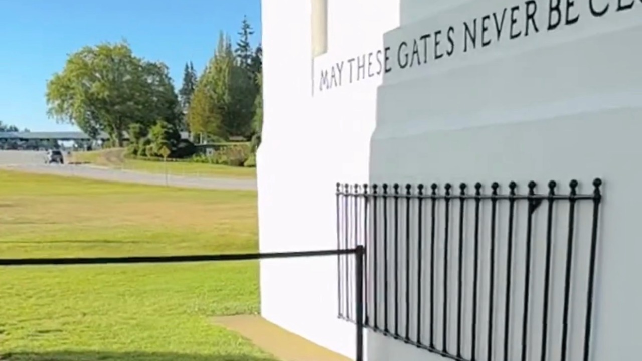 A temporary barrier stretches across the Peace Arch Monument at Peace Arch Historical Park in Blaine, dividing the international park ahead of the 2026 FIFA World Cup. Officials on both sides of the border have implemented additional security measures as Seattle and Vancouver prepare to host tournament matches.
