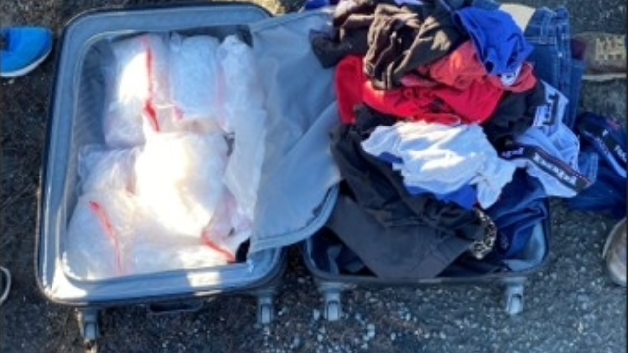 Law enforcement recovered approximately 14 pounds of methamphetamine concealed beneath clothing in a suitcase during a 2022 traffic stop involving Antonio Velazquez Encinas and his aunt.