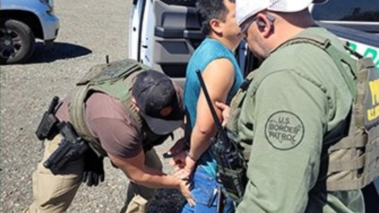 A Mexican national arrested near Lynden on Monday is escorted into custody by U.S. Border Patrol agents. Federal officials said the individual had a prior DUI arrest and is being held for removal proceedings.