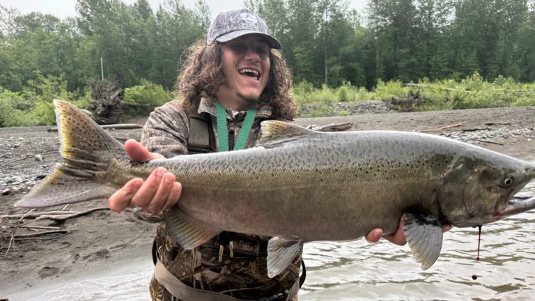 Chris Hamilton holds a buck chinook salmon on Sunday, June 7, 2026.