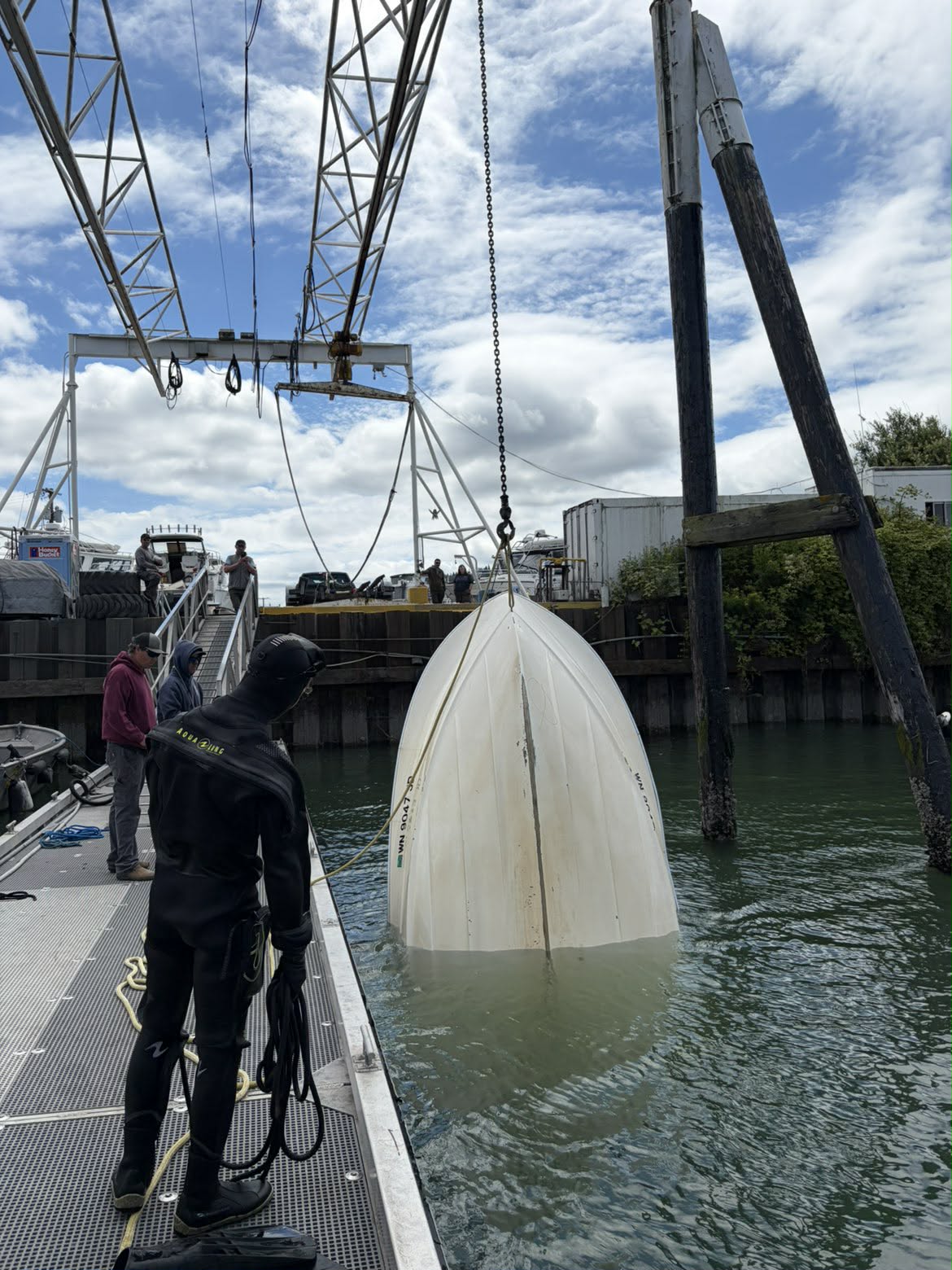 Recovered capsized boat towed across Bellingham Bay