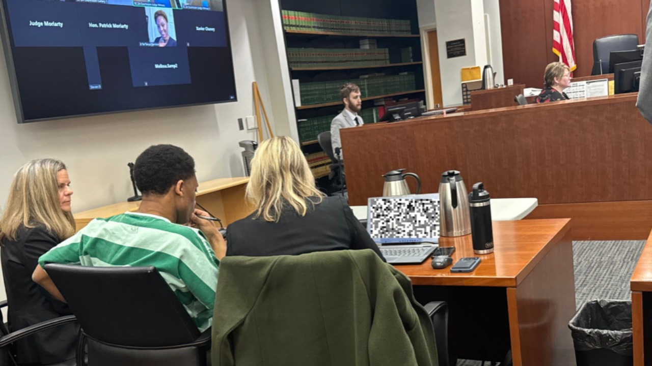 Christopher Joseph Johnson, left, appears in Snohomish County Superior Court during proceedings related to the 2022 home invasion robbery and murder of Irah Marcello Sok. Johnson later pleaded guilty to second-degree murder in state court and was sentenced to 25 years in prison. The sentence will run concurrently with his 25-year federal racketeering sentence.