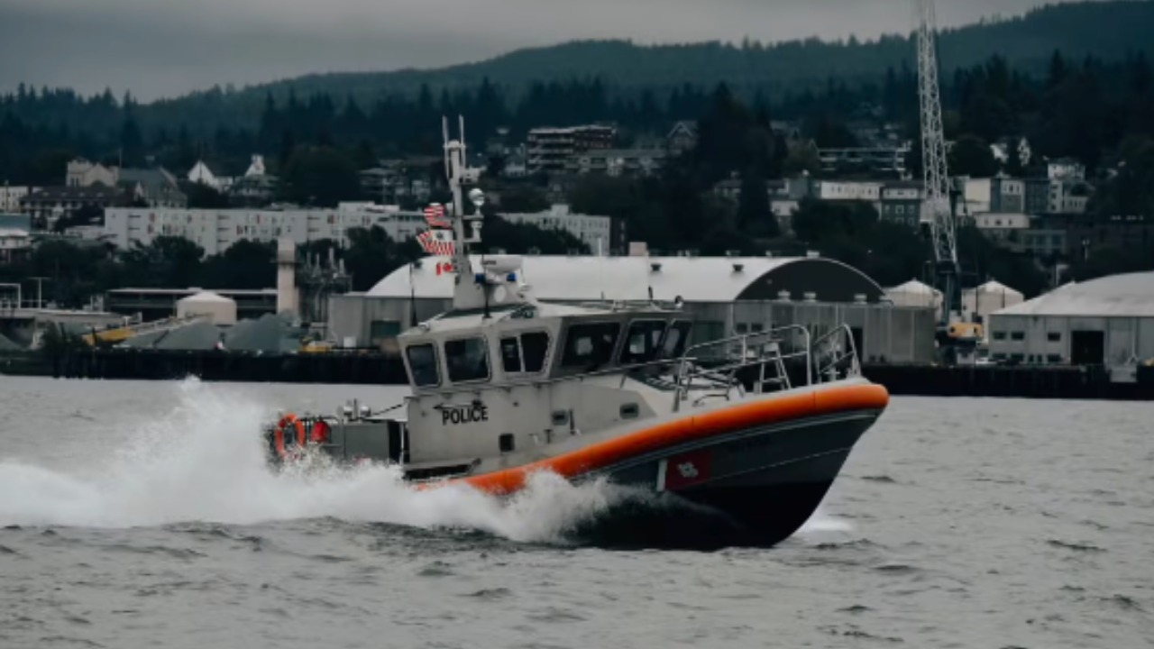A U.S. Coast Guard 45-foot Response Boat-Medium races across Bellingham Bay during a previous operation. Coast Guard crews joined the Bellingham Fire Department on July 4 in a rescue attempt after a boat carrying a single occupant capsized. The 49-year-old man was later pronounced dead.