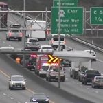 A WSDOT traffic camera shows emergency crews responding to a collision on eastbound SR 18 near C Street SW in Auburn. The image is from a separate incident at the same location.