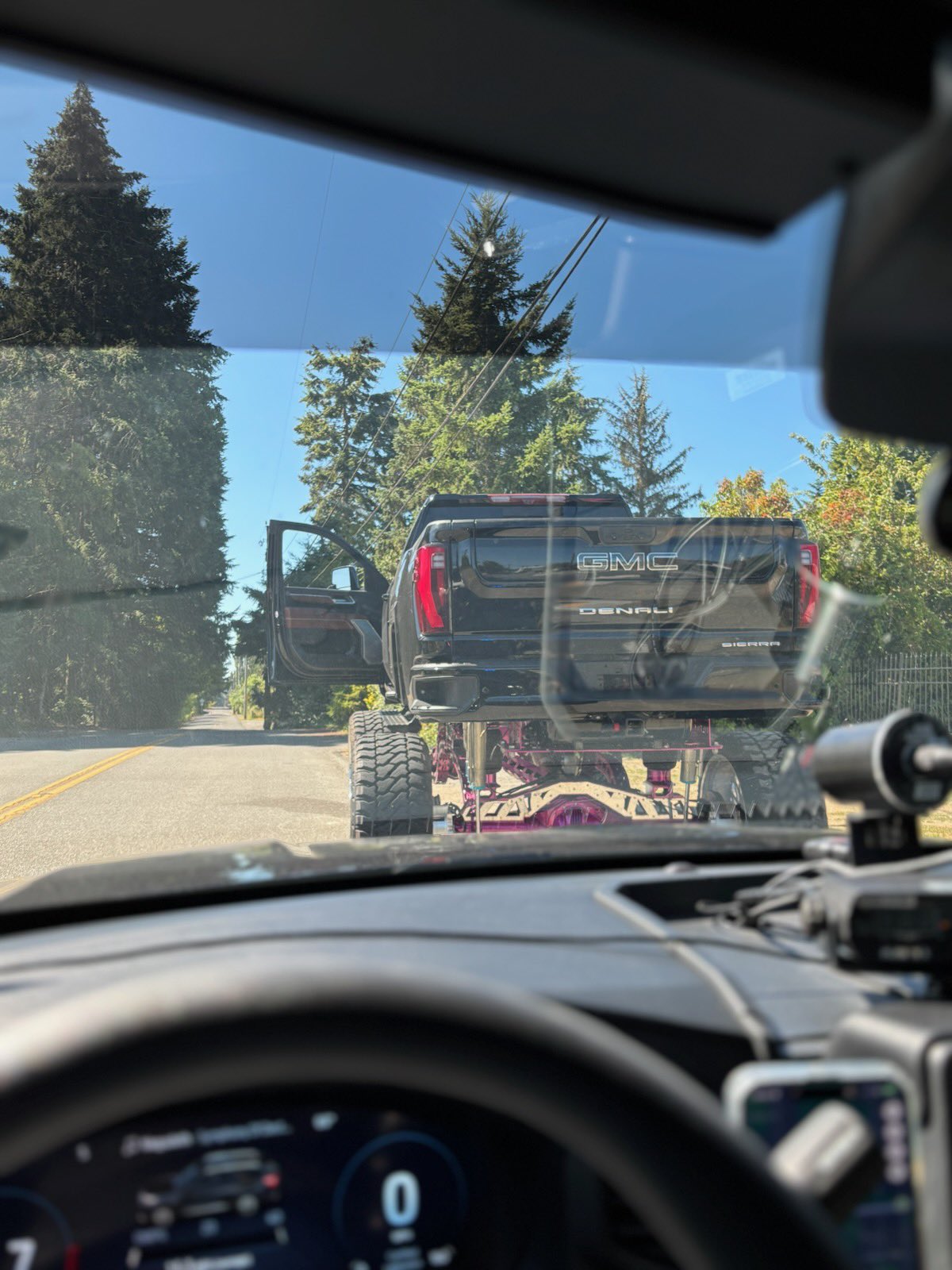 A heavily lifted GMC Denali pickup stopped by Washington State Patrol