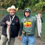 Brian Henderson of PNW Daily and Chris Hamilton of Yeager's Sporting Goods hold up coho caught on the Nooksack River on Oct. 1, 2024.