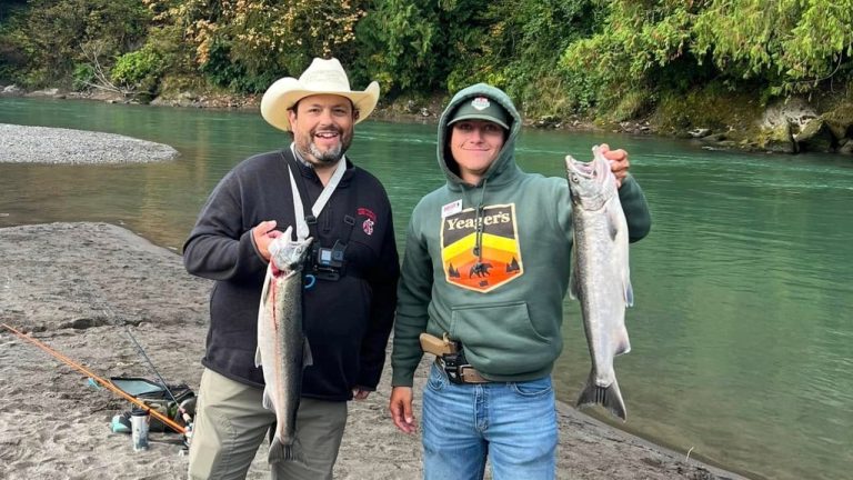 Brian Henderson of PNW Daily and Chris Hamilton of Yeager's Sporting Goods hold up coho caught on the Nooksack River on Oct. 1, 2024.