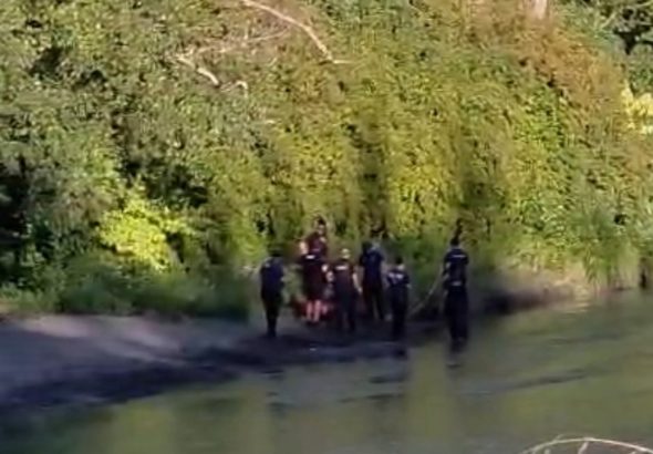 Emergency crews respond along the Nooksack River near Hovander Park after a 10-year-old girl became stranded in the water Wednesday evening.