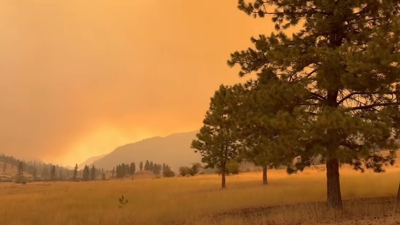 Smoke from the Sinlahekin Fire fills the sky near Loomis on July 30. The lightning-caused wildfire has burned more than 73,000 acres in Okanogan County.