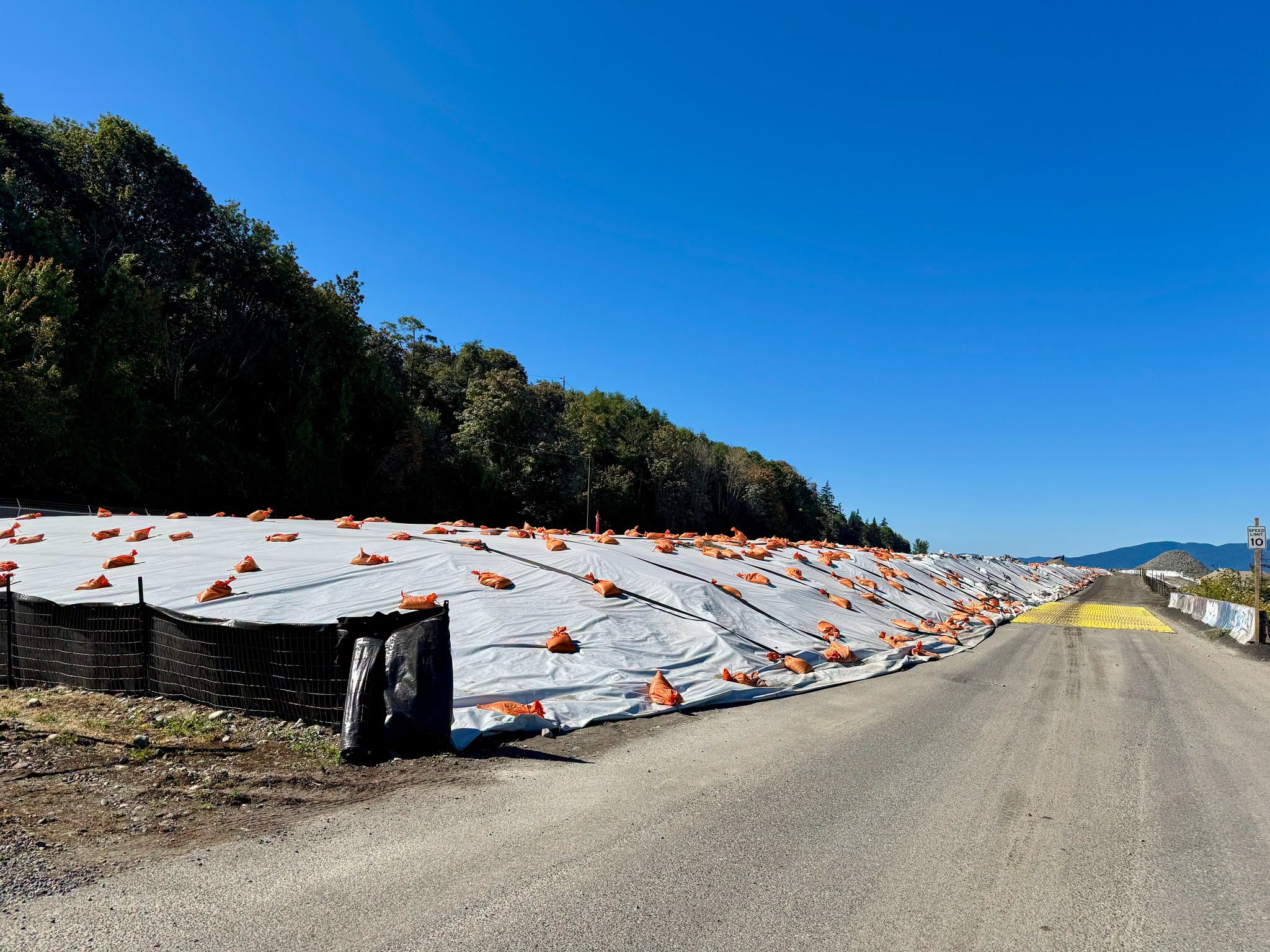 Protective coverings stretch across part of the R.G. Haley and Cornwall Avenue Landfill cleanup site along Bellingham Bay. The nearly $49 million project will address historic contamination and prepare the property for Salish Landing Park.