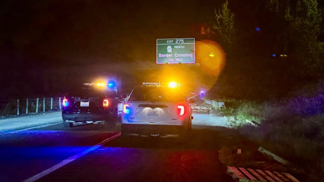 Blaine Police and Washington State Patrol vehicles block northbound I-5 near Exit 275 as pallets sit along the shoulder Monday night.