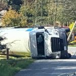 The tanker truck lies on its side on Taylor Street as Bellingham firefighters respond to the scene.