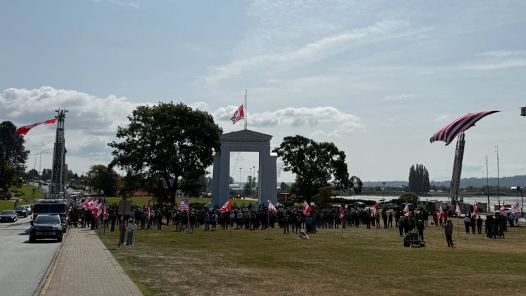Fire trucks flanked the Peace Arch with American and Canadian flags as crowds gathered on both sides of the border for the 25th anniversary ceremony.