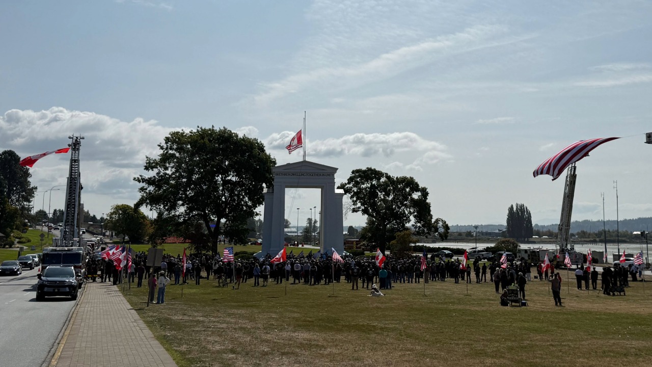 Fire trucks flanked the Peace Arch with American and Canadian flags as crowds gathered on both sides of the border for the 25th anniversary ceremony.