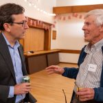 Gov. Bob Ferguson speaks with Mike Hyde at the At-Sea Processors Association's fall breakfast in Seattle.
