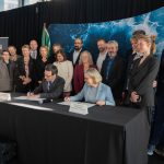 Gov. Bob Ferguson and Danish Deputy Chief of Mission Karen Eva Abrahamsen sign a memorandum of understanding to expand cooperation between Washington state and Denmark during One Ocean Week in Seattle. The agreement focuses on maritime decarbonization, port development, sustainable fuels and industrial innovation.